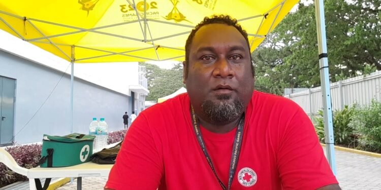 Red Cross Volunteers Team Leader, Dean Ngatulu, Making a Difference at the Pacific Games